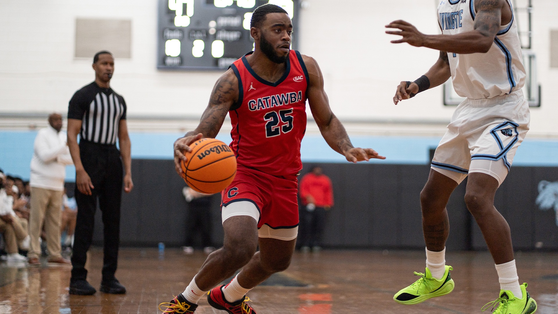 Jashaun Hawkins dribbling through defenders against Livingstone