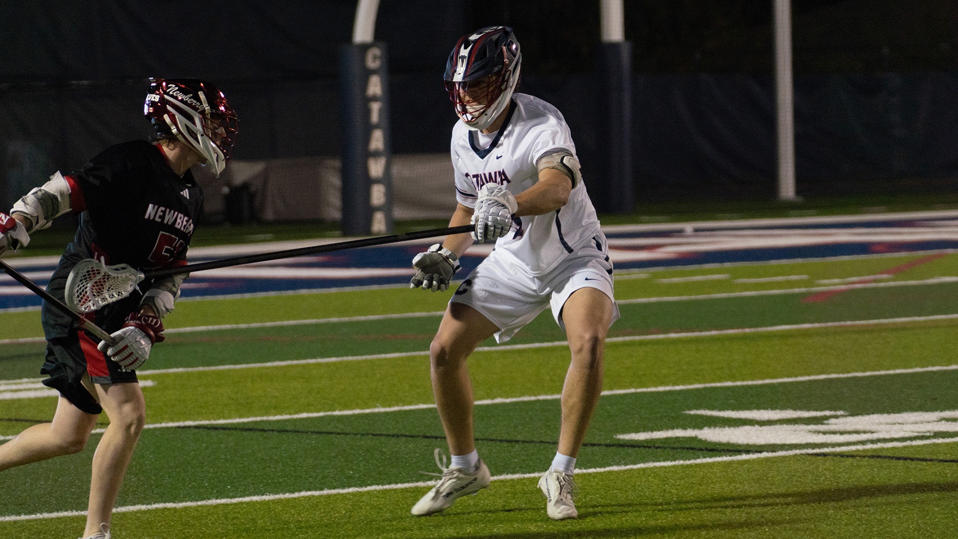 Owen Conway poke checks a Newberry attacker