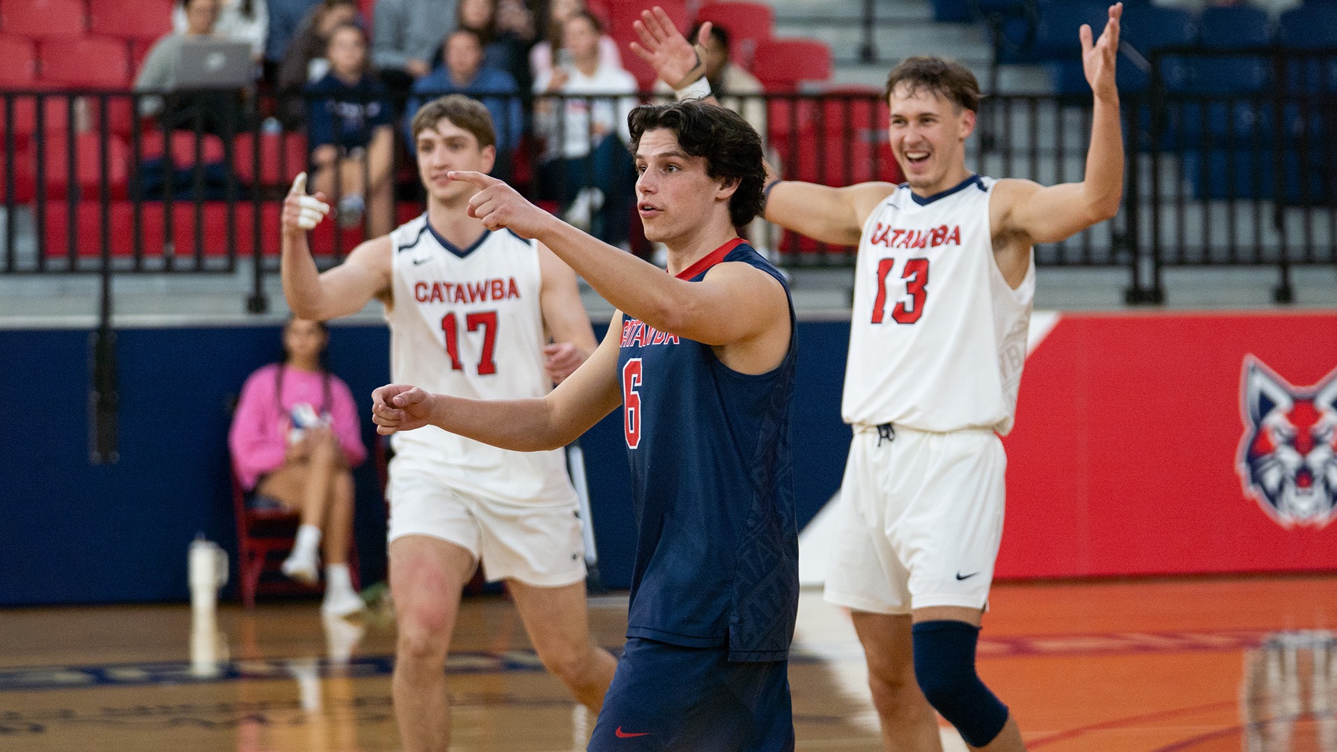 Max Adkisson looks for confirmation on a point with Anders Christianson and Justin Arrowood celebrating behind