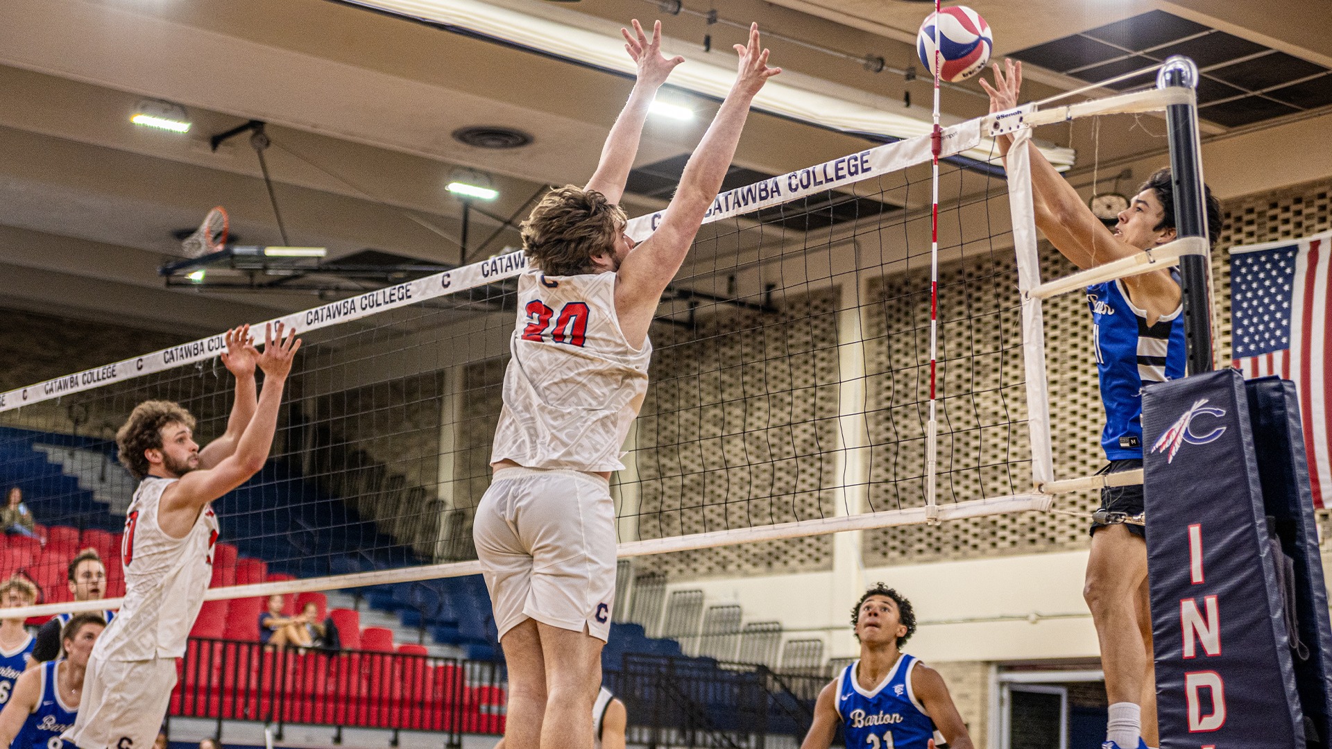 Kristian Smith leaping for a block attempt against Barton