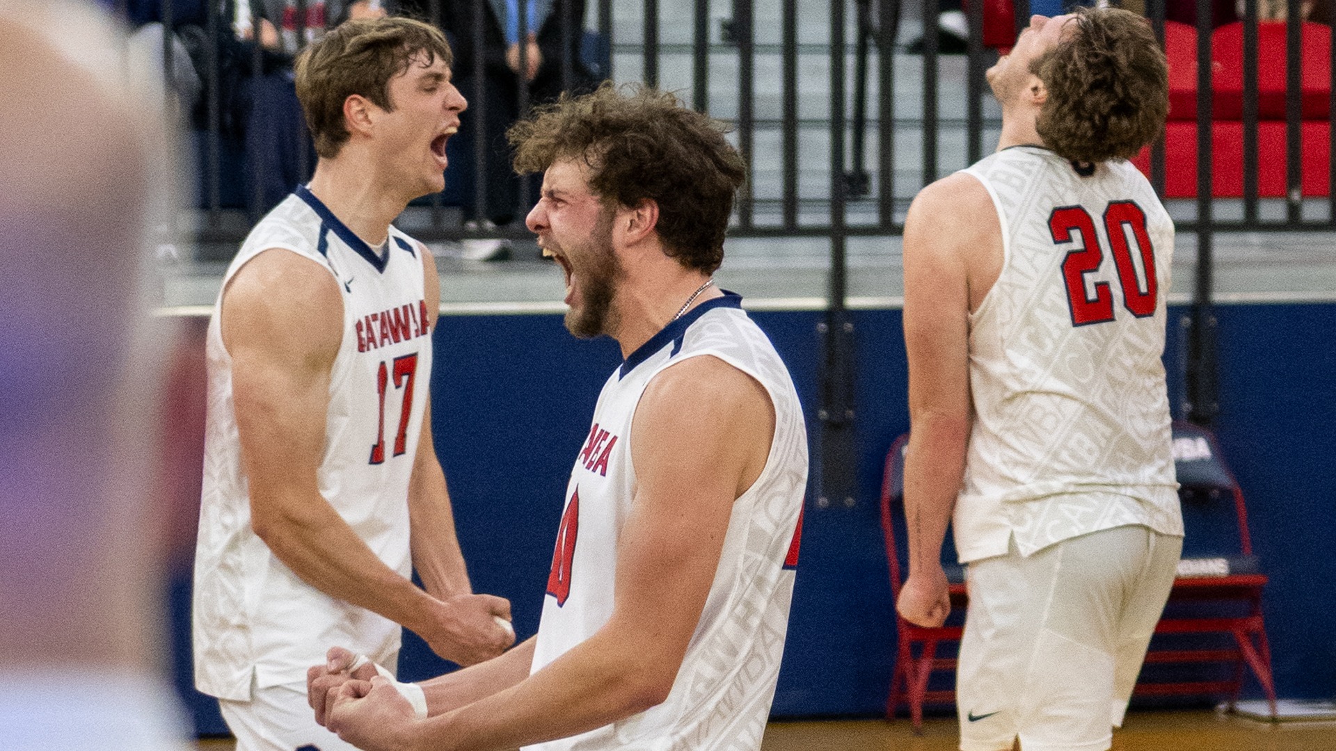 Wyatt Eastin, Anders Christianson, and Kristian Smith yell in elation on a victorious point against Newberry