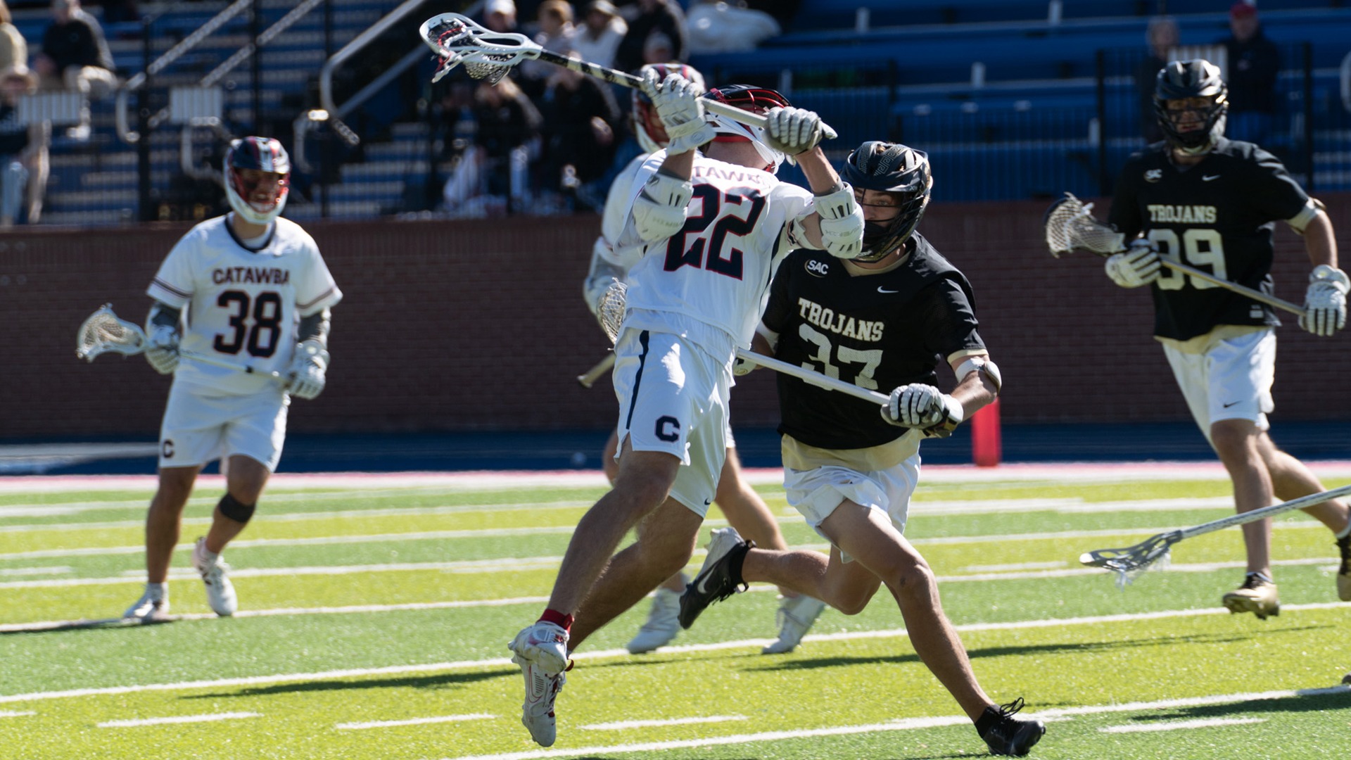 Michael Lindsey leaps while firing a shot against Anderson