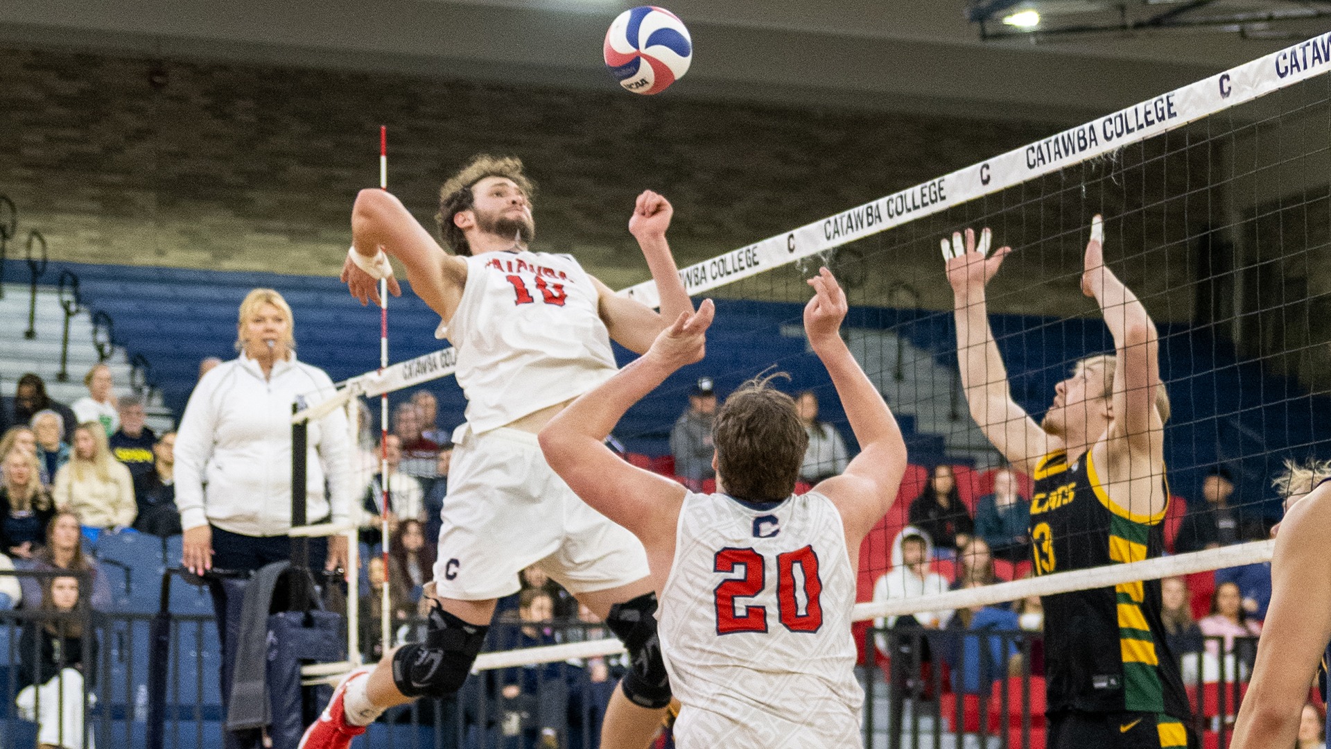Kristian Smith setting a ball for Wyatt Eastin against Lees-McRae