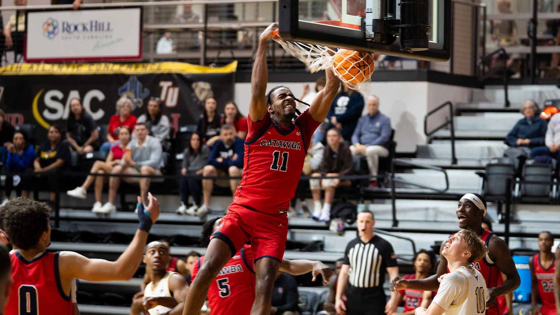 Solomon Tucker slamming down a dunk against Anderson
