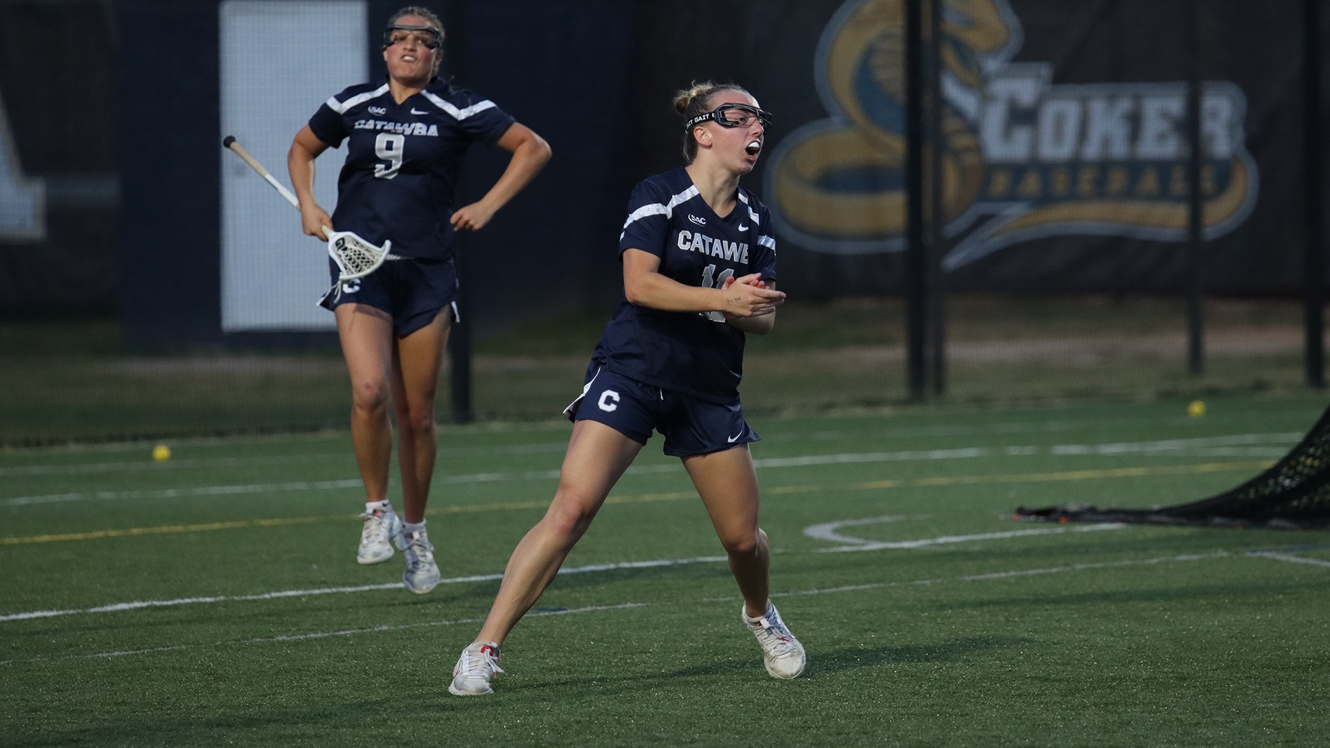 Abby Shuren jumps and claps in elation after scoring a goal at Coker