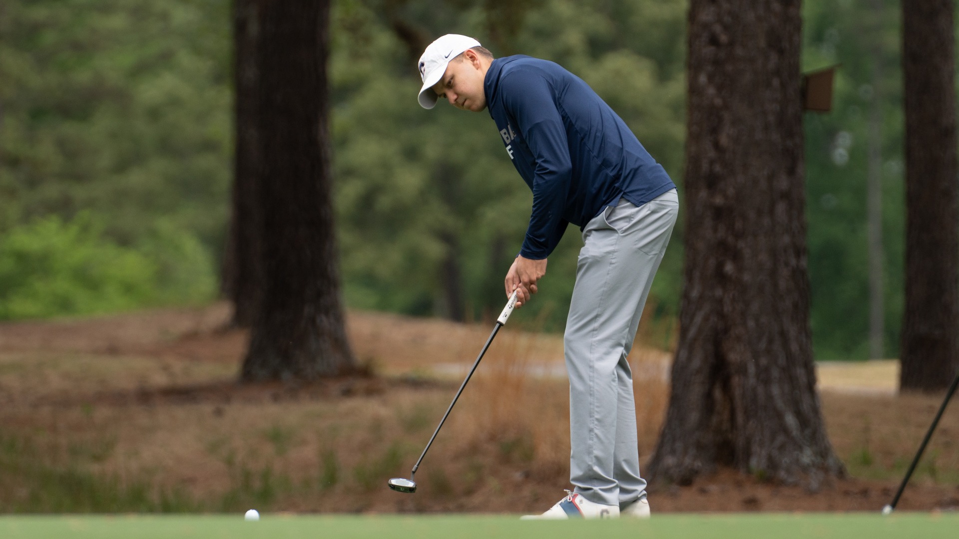 Ilia Antoniadis making a putt at the SAC Championship