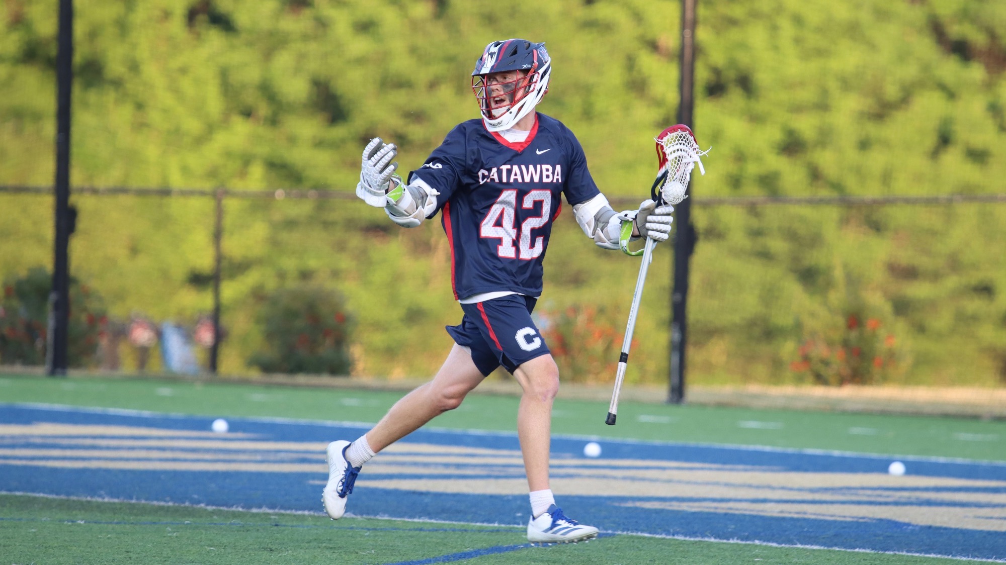Micah Stechmiller motioning to teammates at Wingate