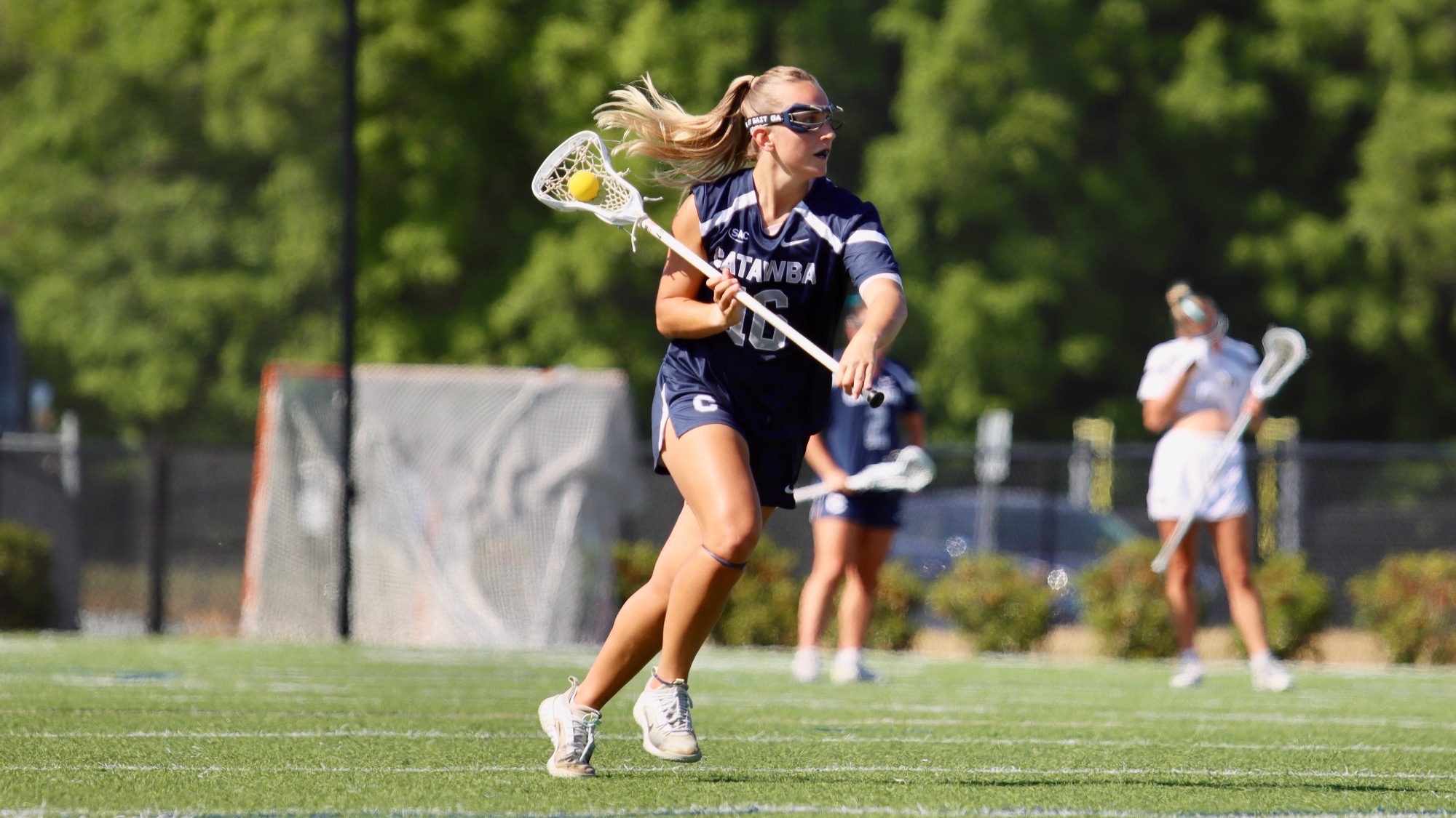 Kylie Harris moving the ball up field at Wingate