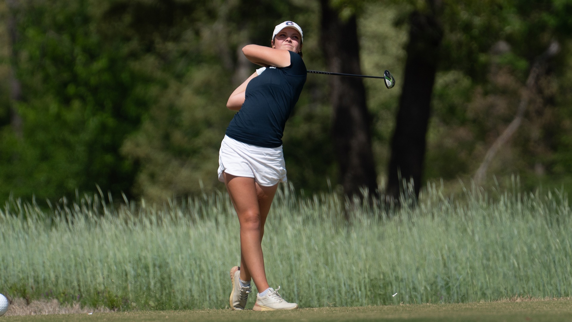 Mary-Paige King teeing off a hole at the SAC Championship