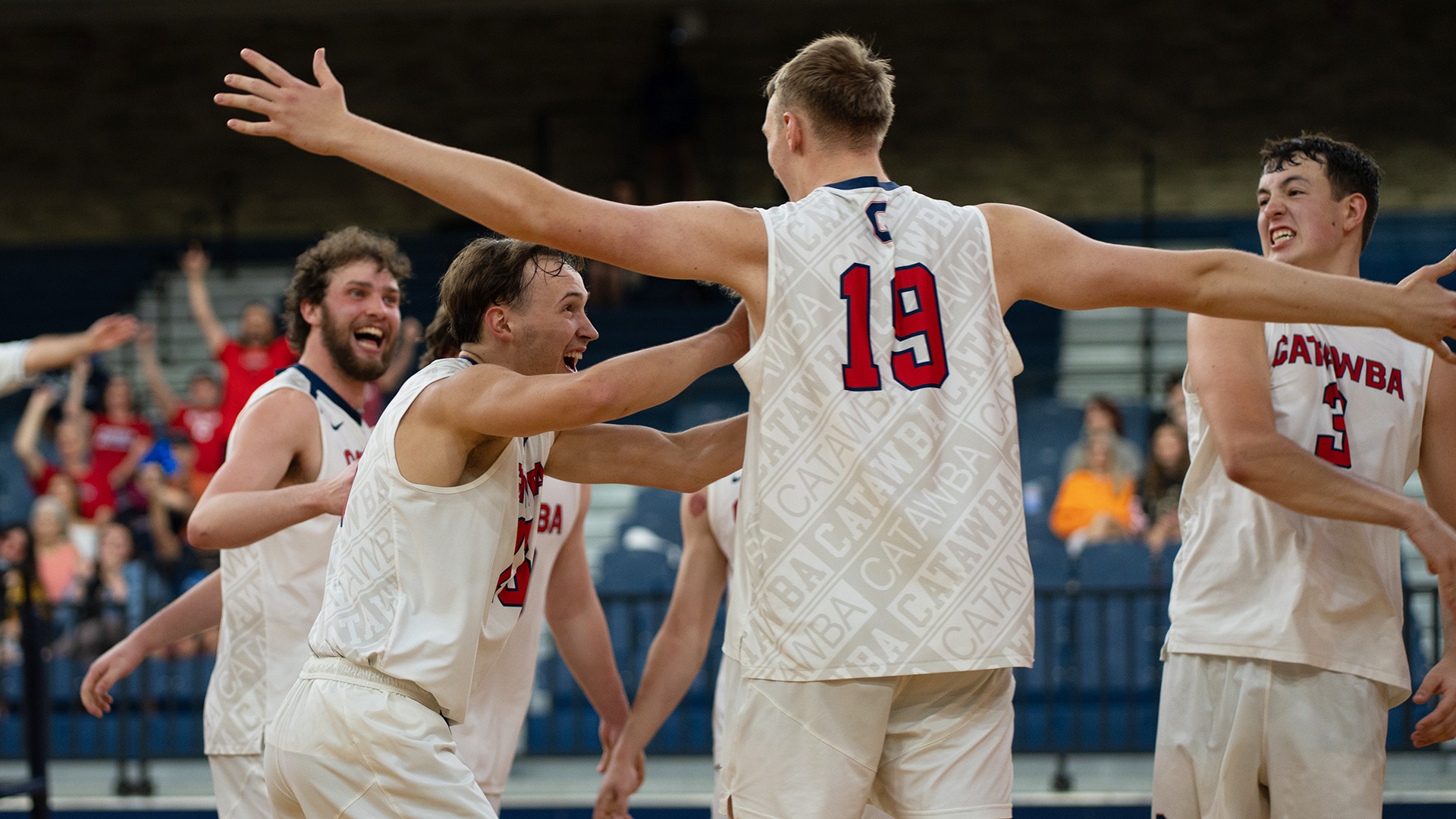 Justin Arrowood presses on Logan Neitzel in celebration against Erskine