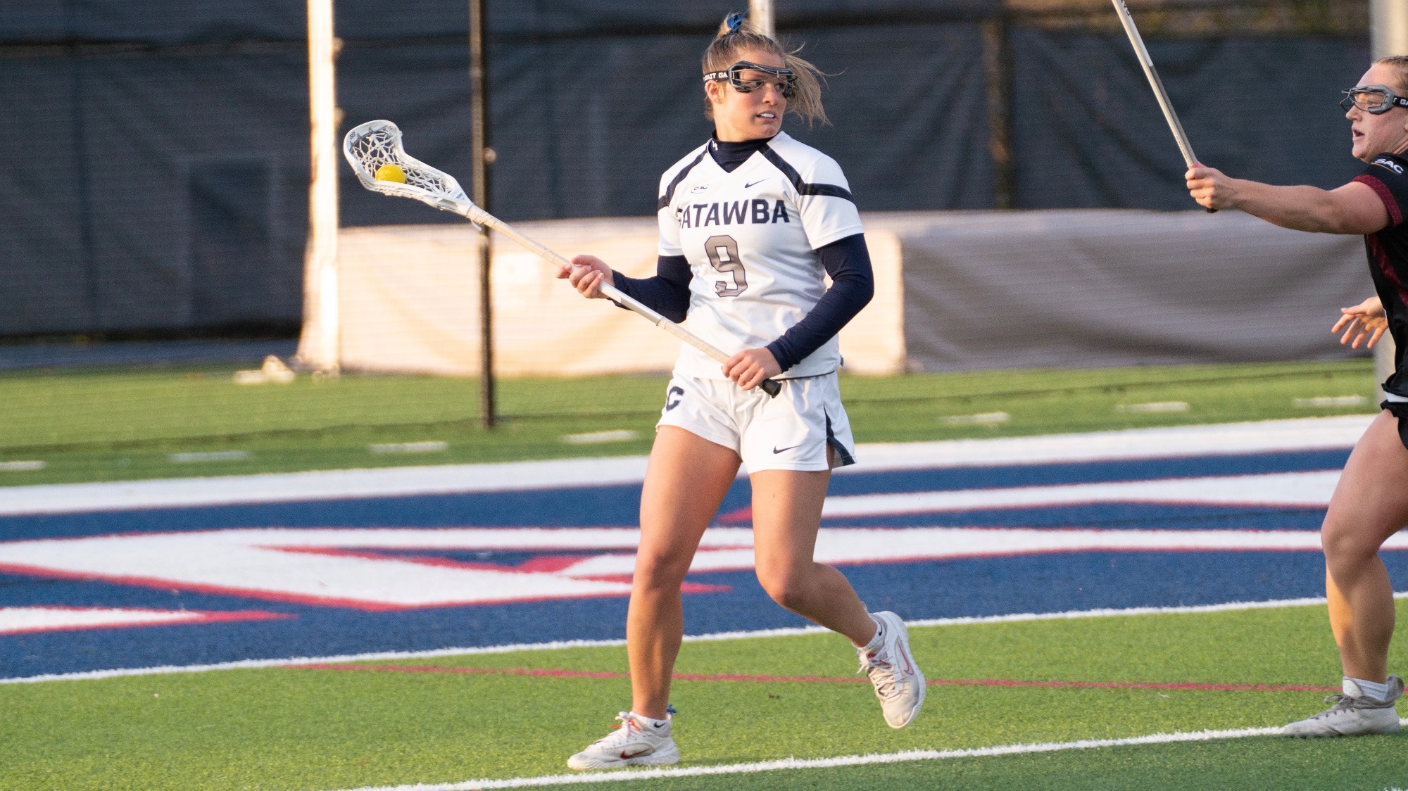 Madison Widecki searching for a passing target against Lenoir-Rhyne