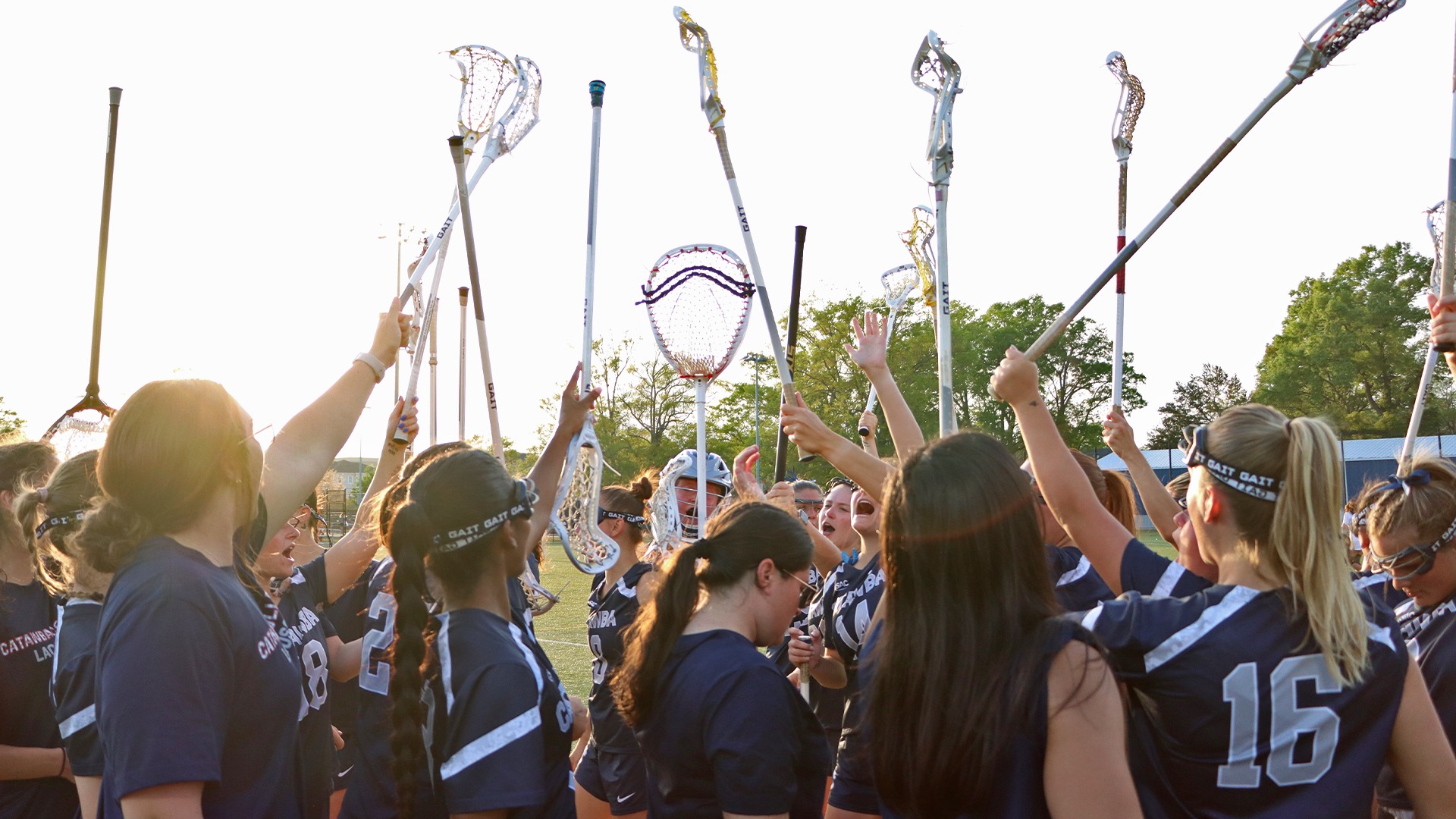 Women's Lacrosse huddle at Coker