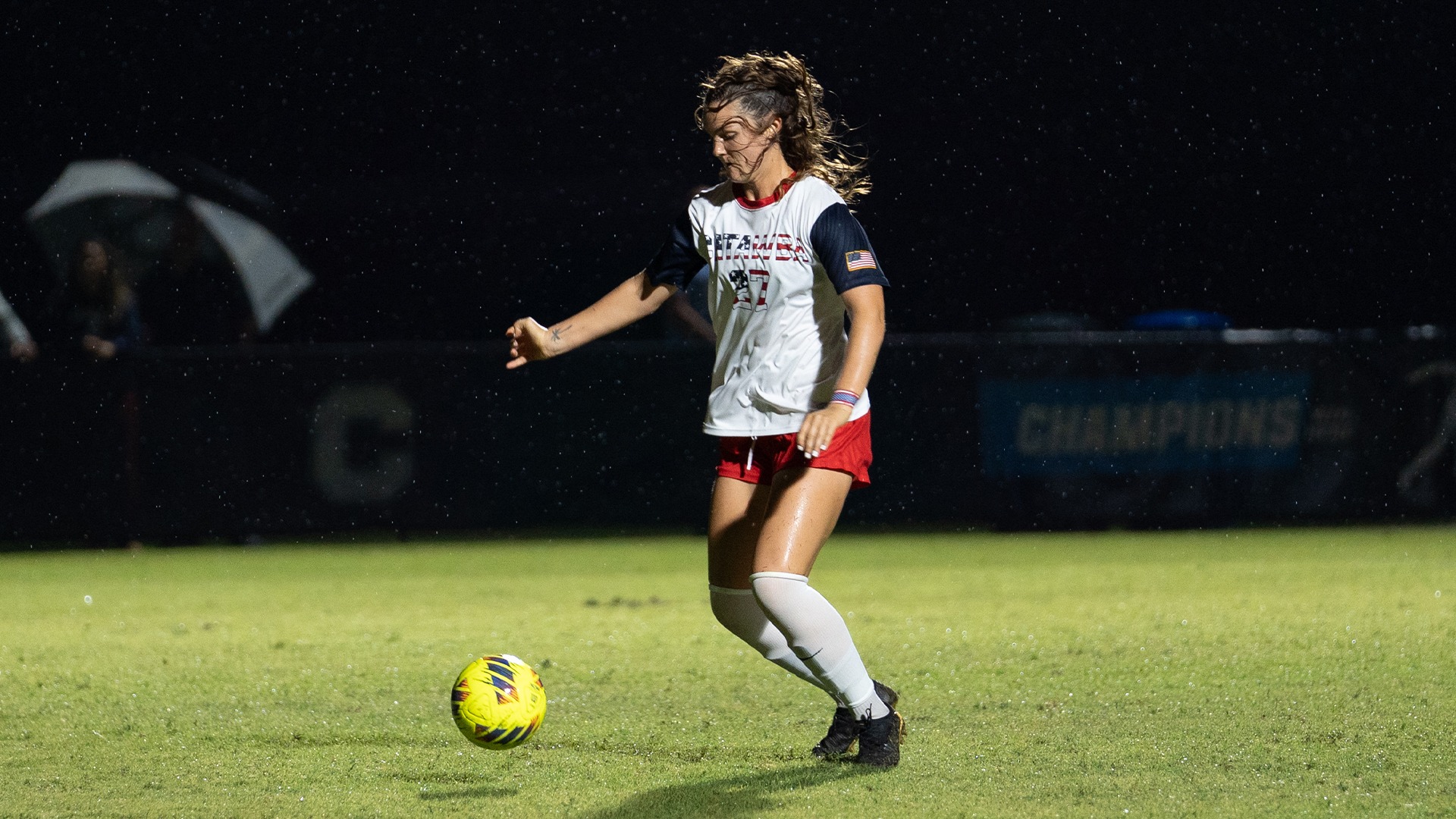 Bree Ehmer controls possession in a rain shower against Mars Hill