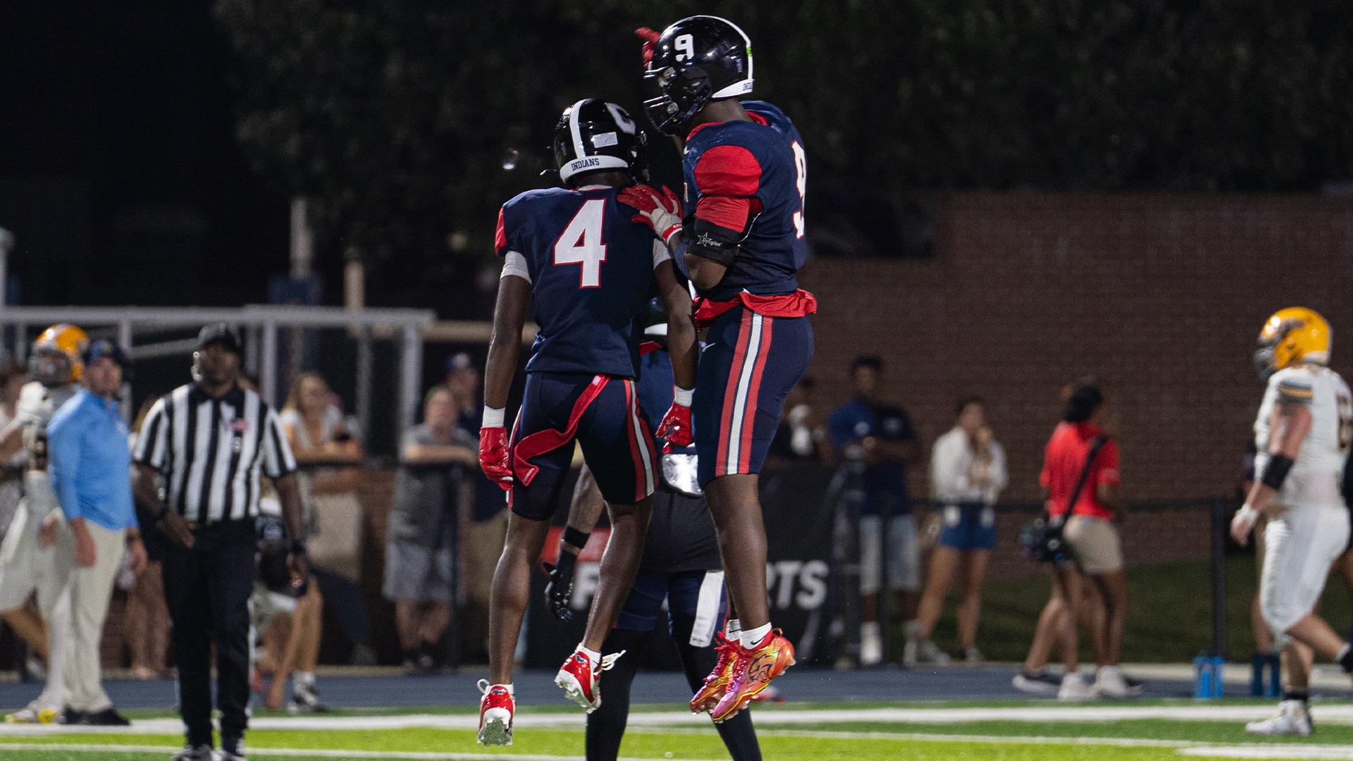 Amond Myers and RJ Brown celebrate a big play against Emory & Henry