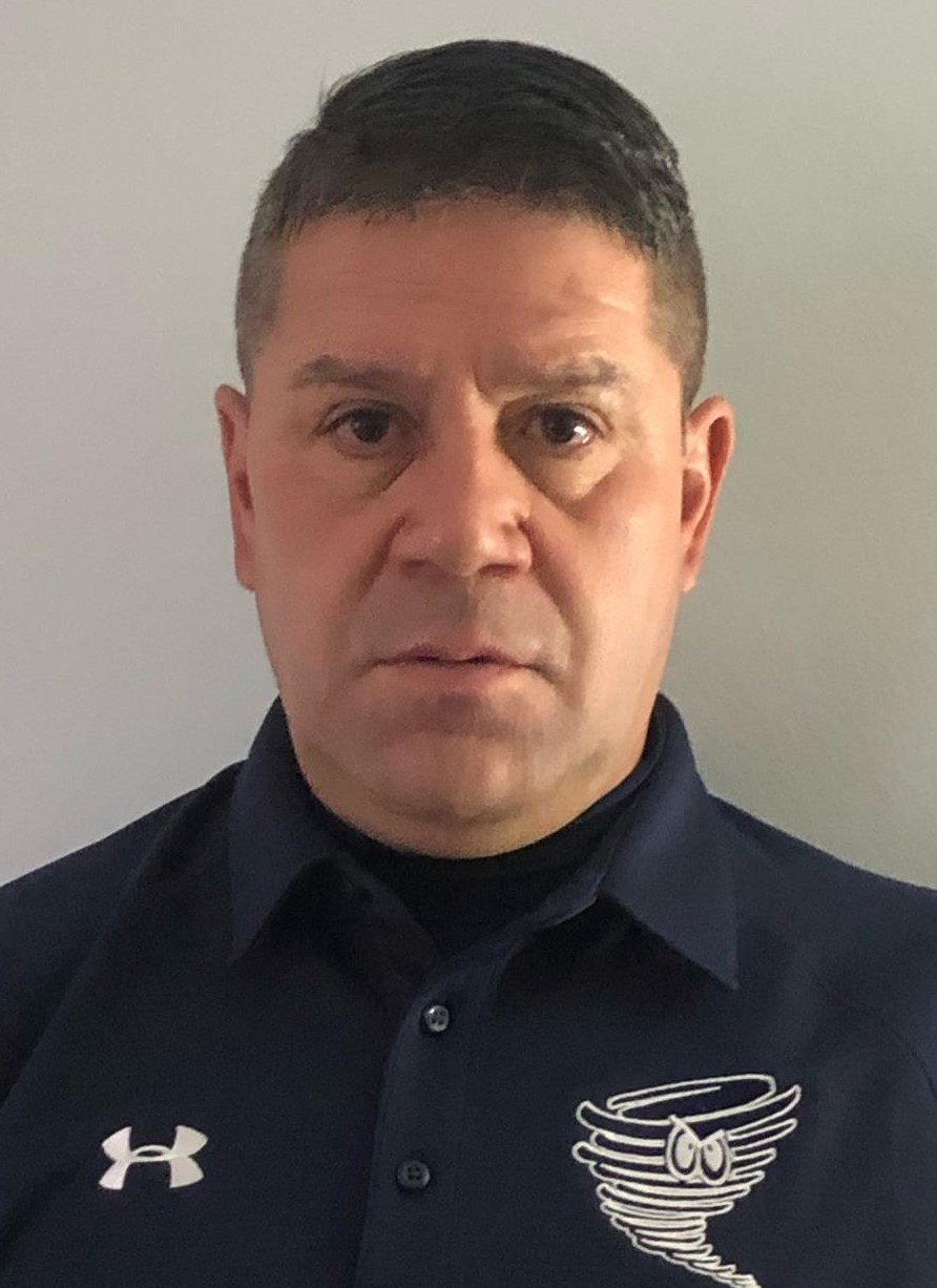 Gritzko Cerda (head and shoulders mug shot in a blue polo shirt with the Cyclone logo)