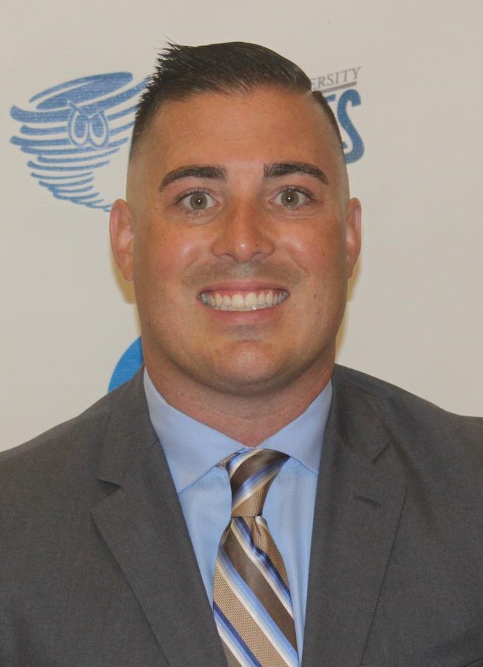Joe Lodato (head and shoulders mug shot in a gray suit jacket and blue shirt wit striped tie)