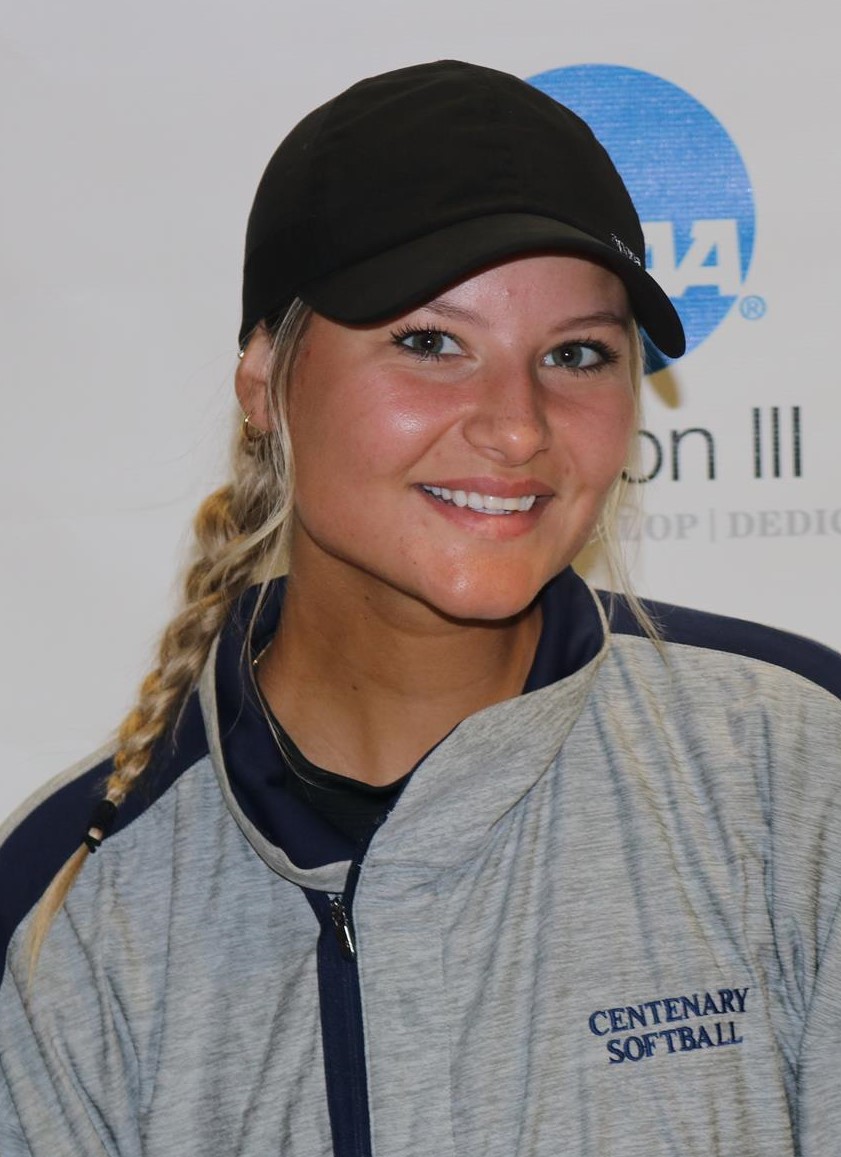 Meghan Hughes (head and shoulders mug shot in a black hat and gray sweatshirt with blue trim)