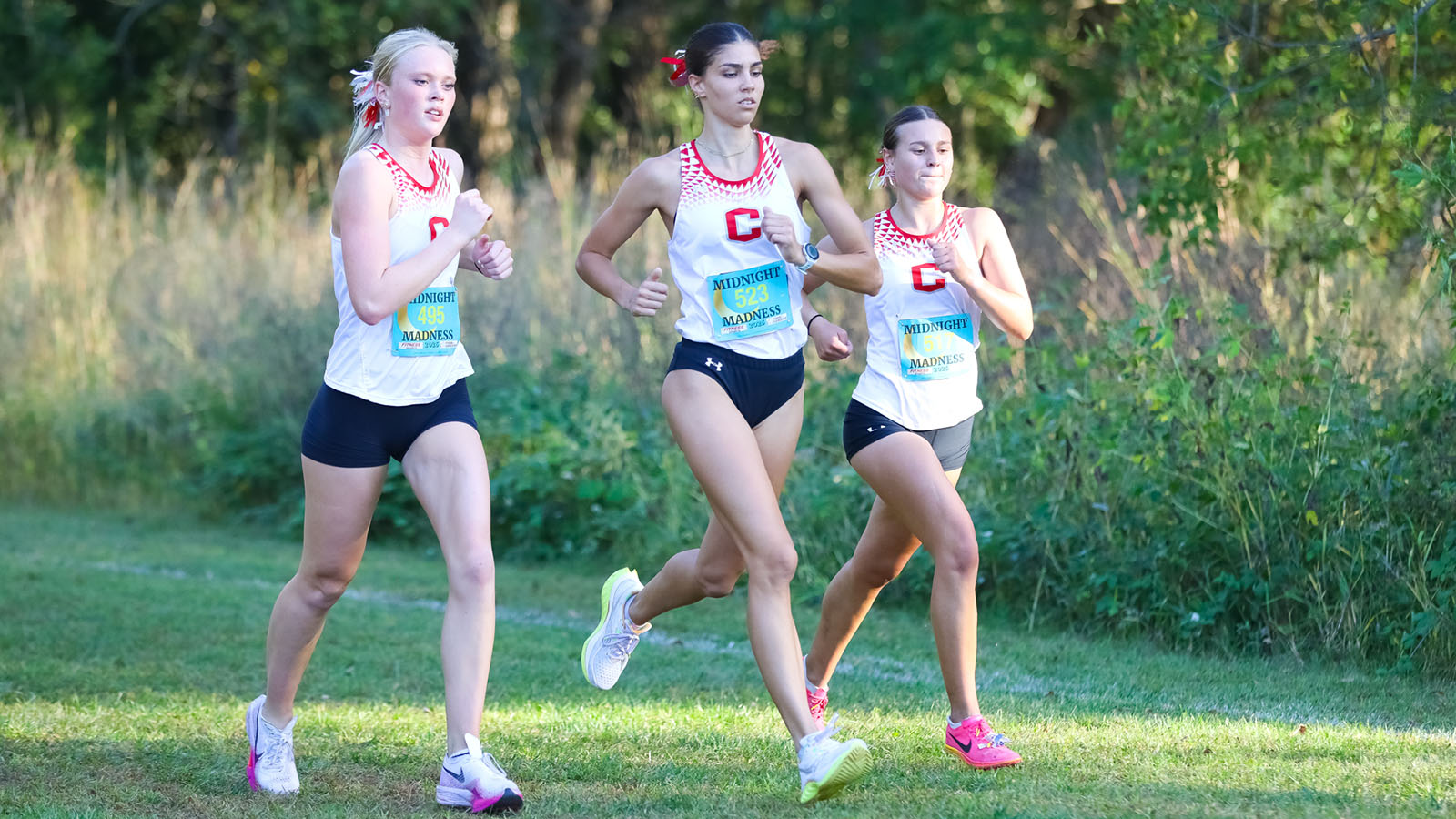 Peyton Steffen runs through two teammates