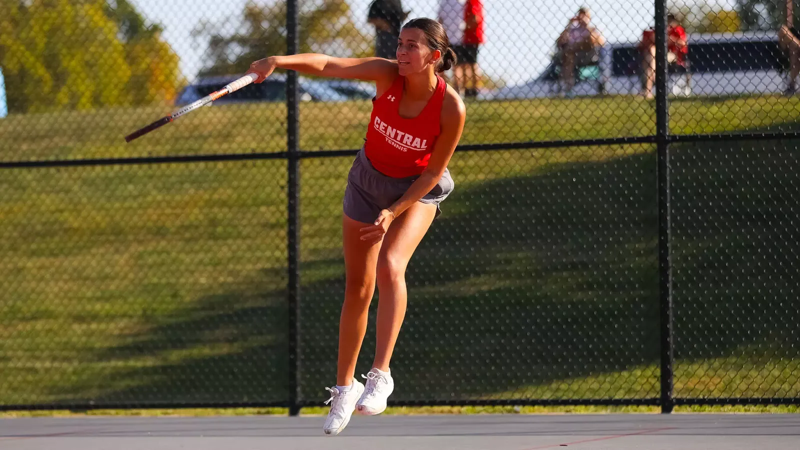 Emma Murphy follows through on a serve