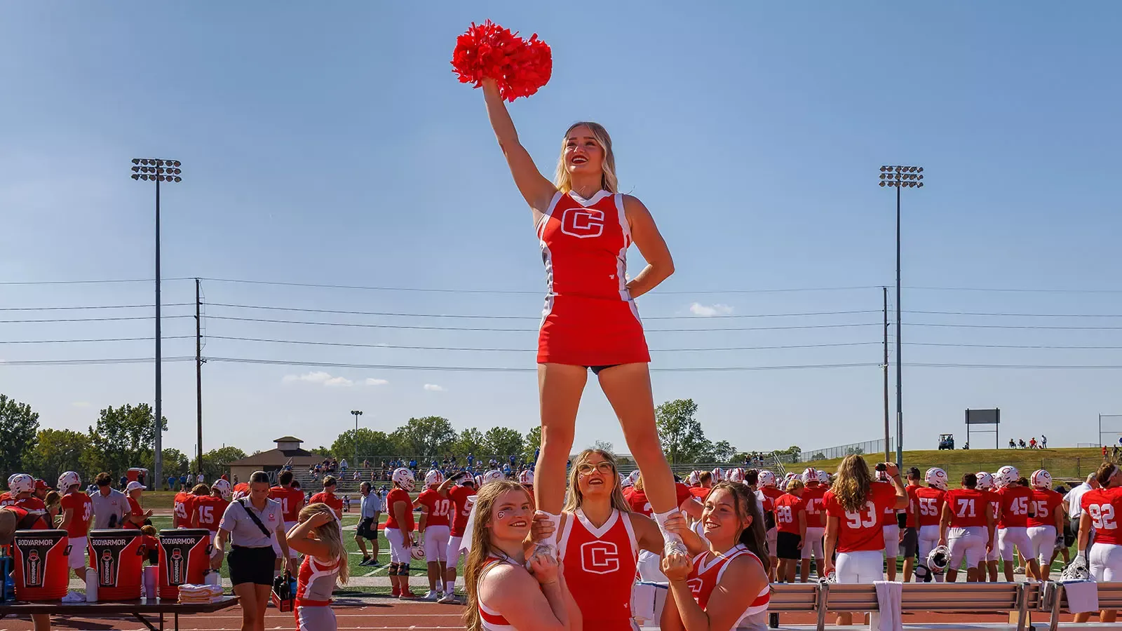 Sydney Buseman as a flyer during cheerleading stunt
