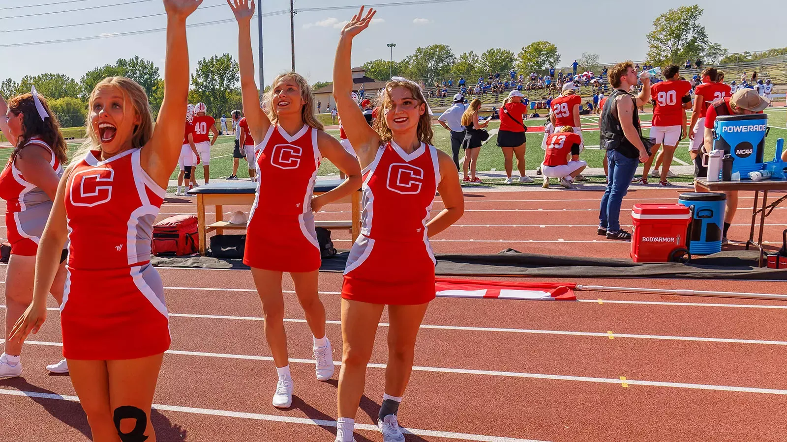 Emily Patten waves at the crowd during Homecoming