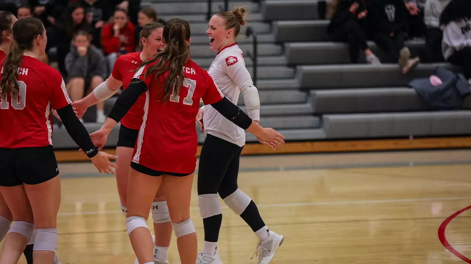 Colleen Kenney celebrating a point with her teammates