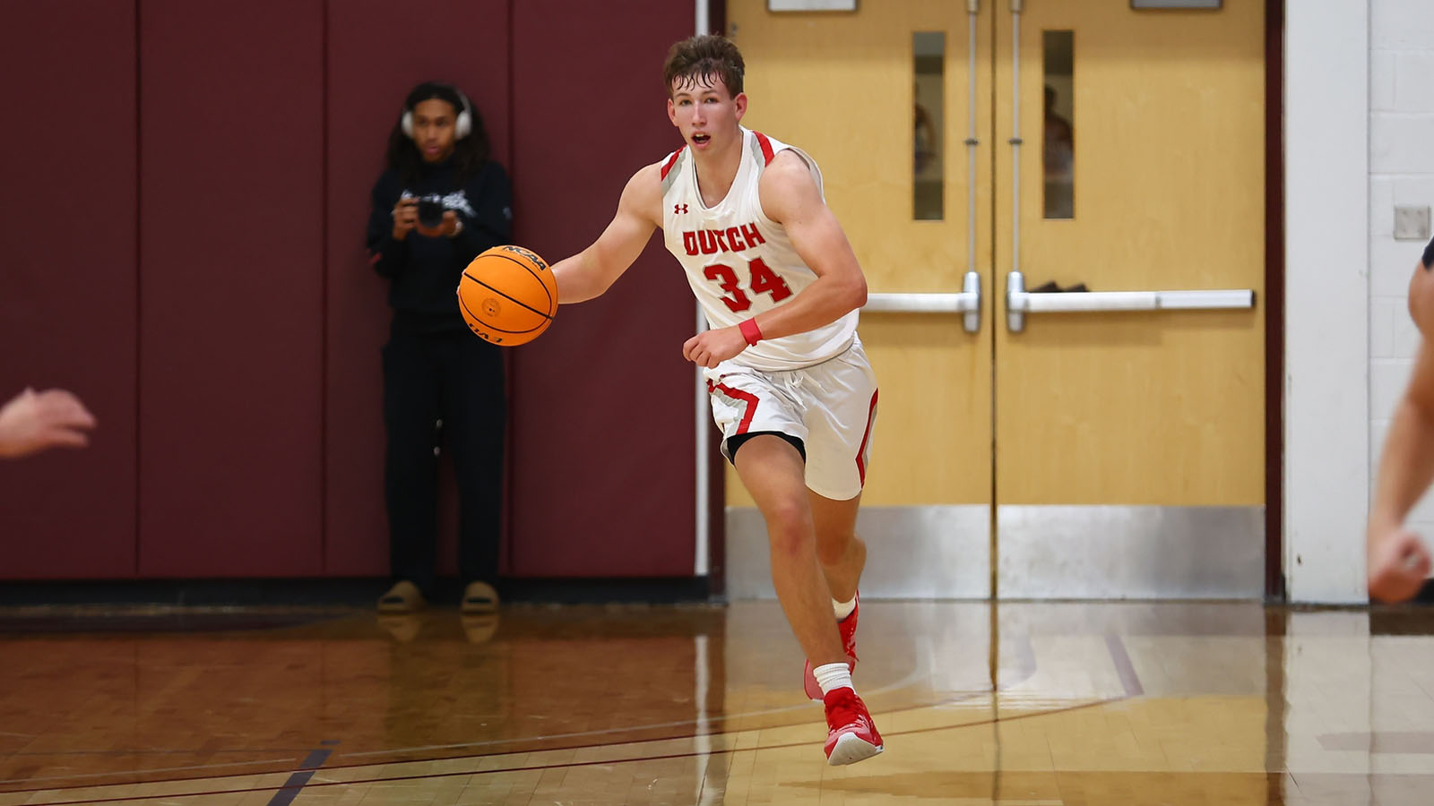 Owen Schipper dribbles up court
