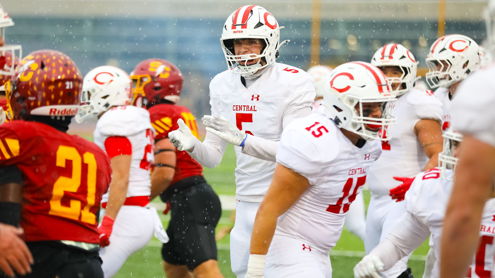Ben DeMeulenaere claps on the sideline