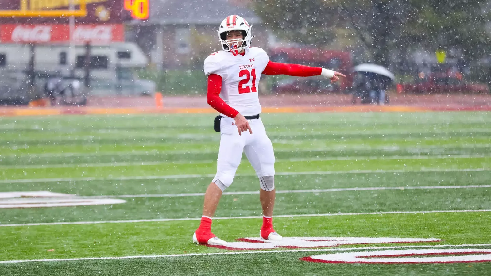 Gavin Smith points to something on the field