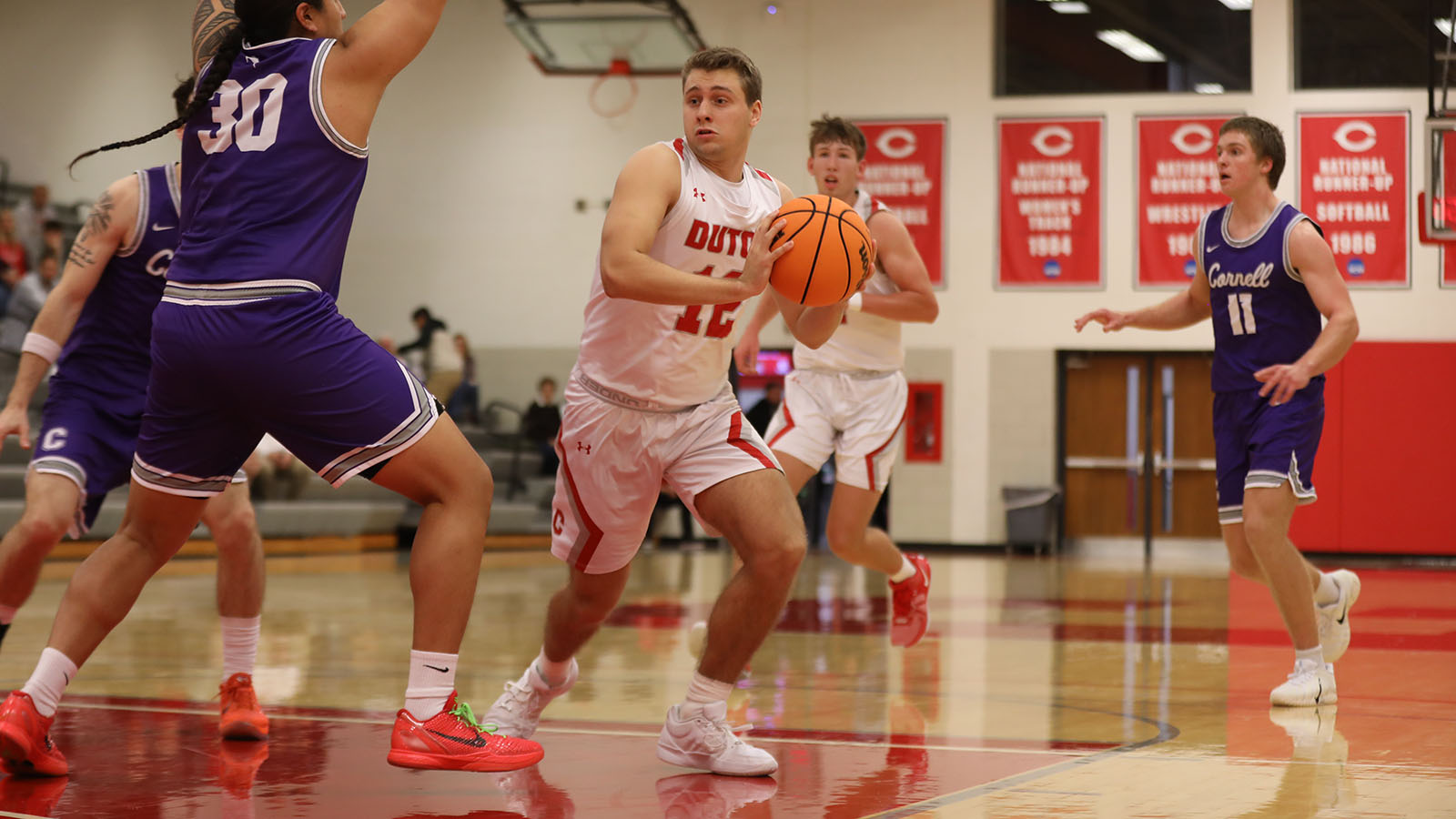 Kyle Cason drives past a defender in the lane