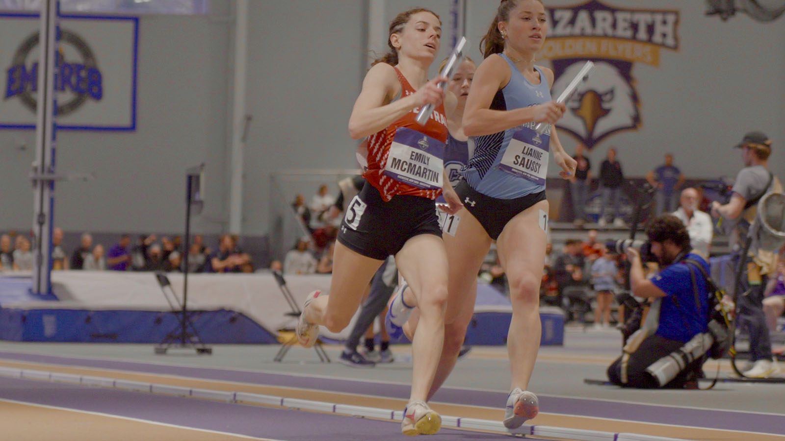 Emily McMartin running in a relay