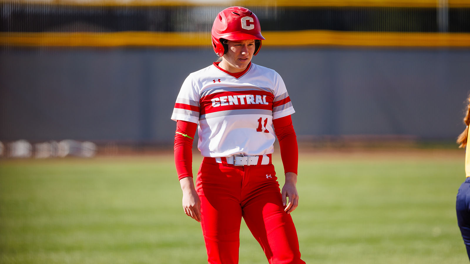 Emma Anderson standing on a base