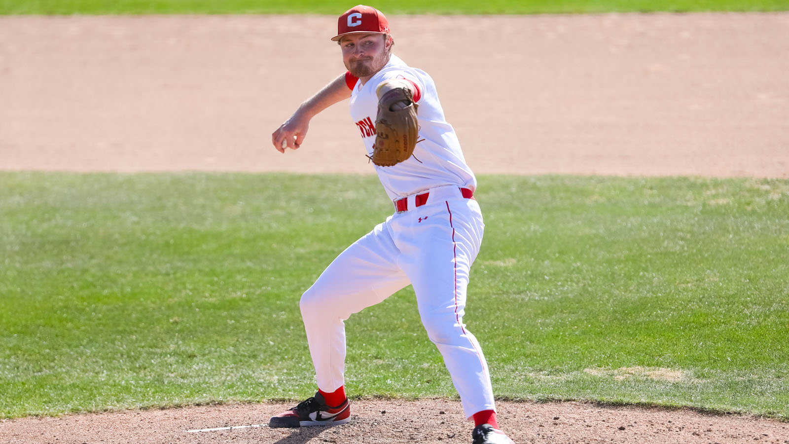 Mark Kenney striding for the pitch