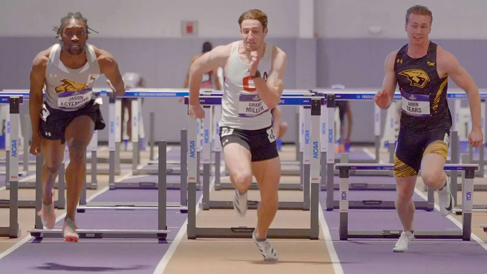 Grant Miller winning his hurdles heat