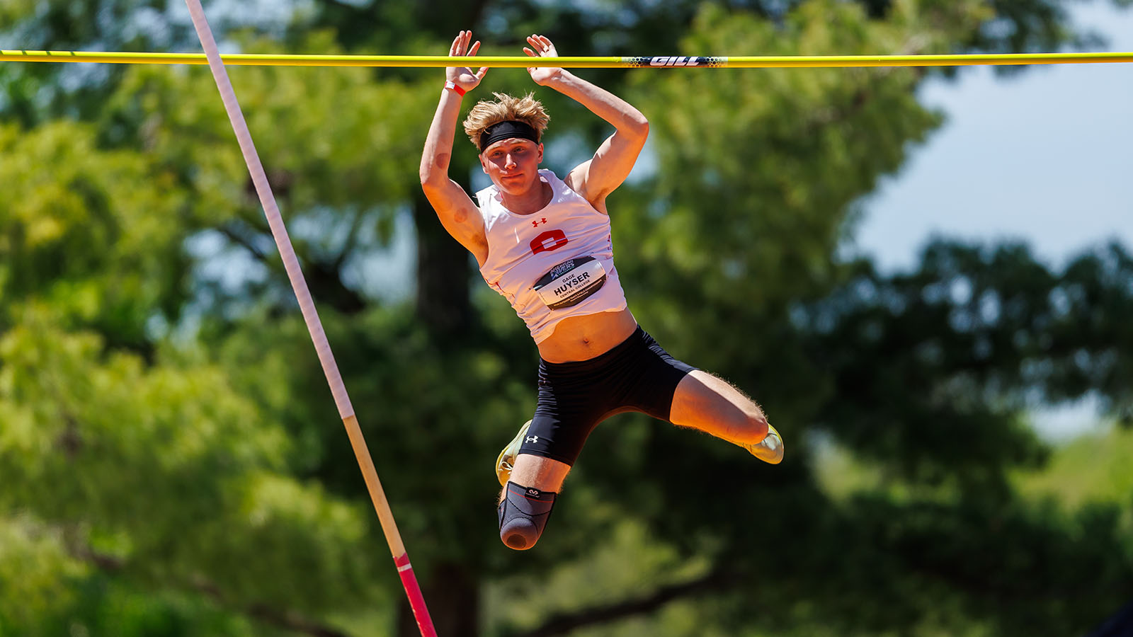 Gage Huyser after clearing pole vault bar