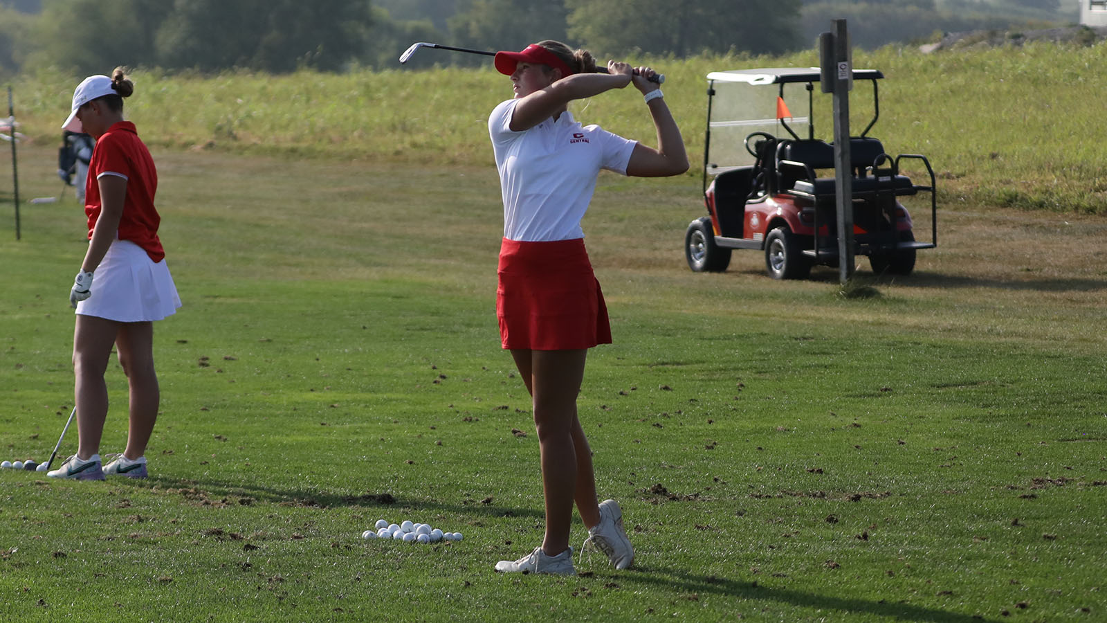 Allie Pfantz on the driving range with a follow through