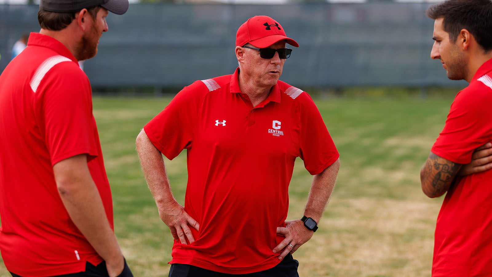 Coach Laidlaw talks with his staff