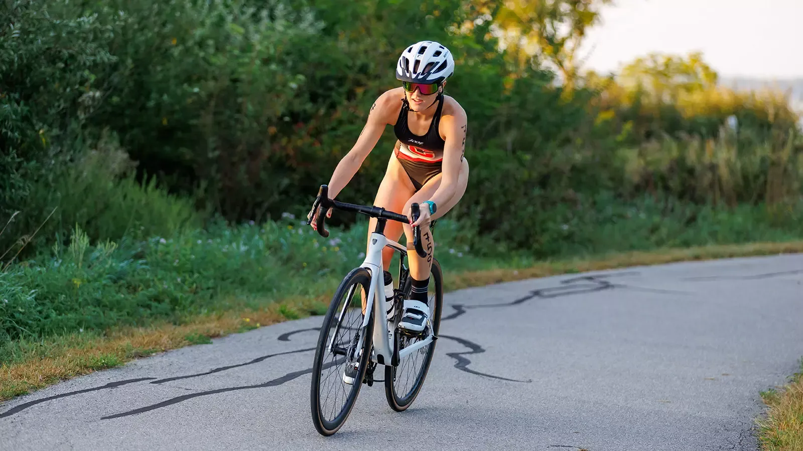 Adeline Koritz coming around corner on bike