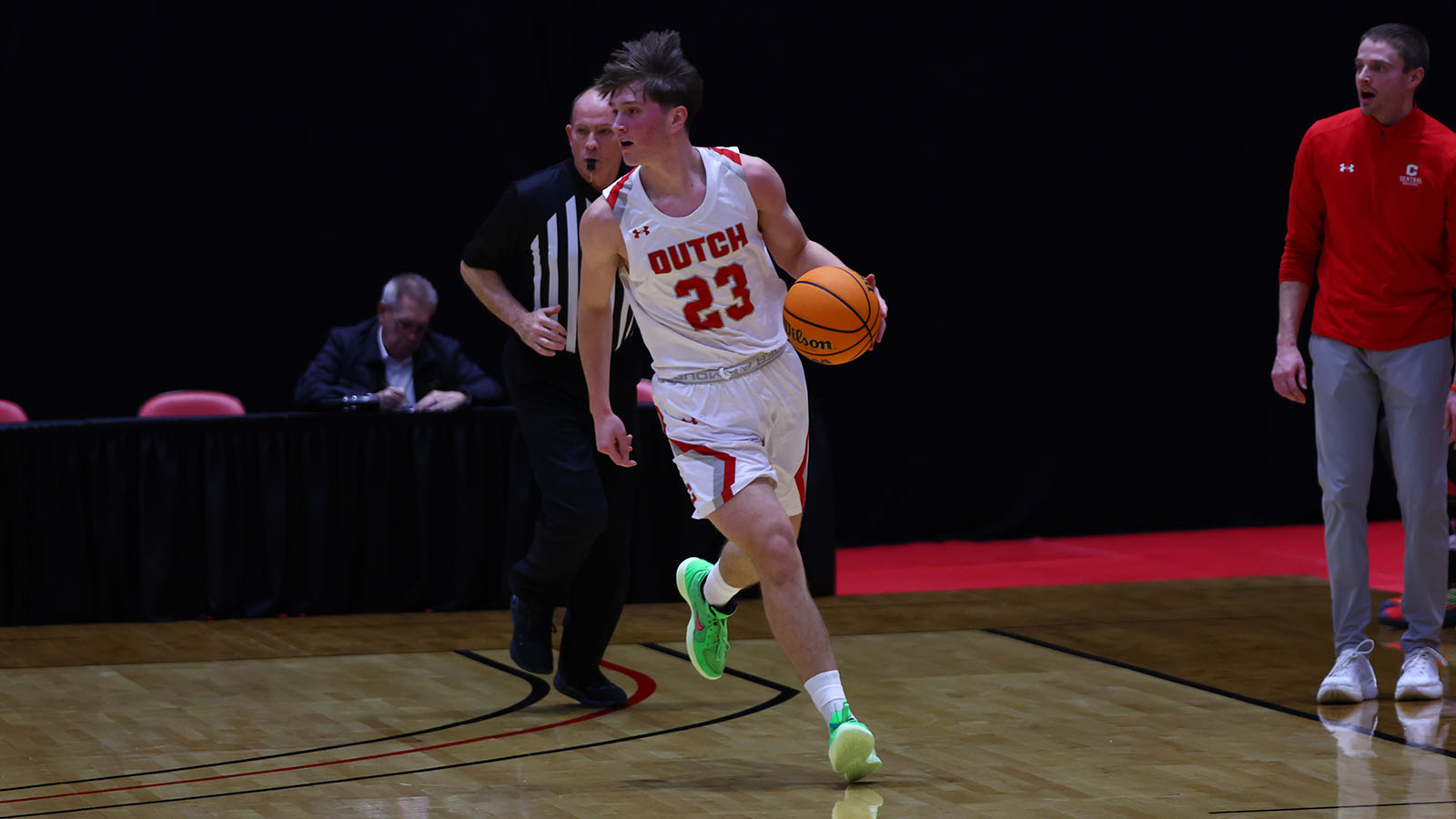 Boaz Clark dribbles up the court