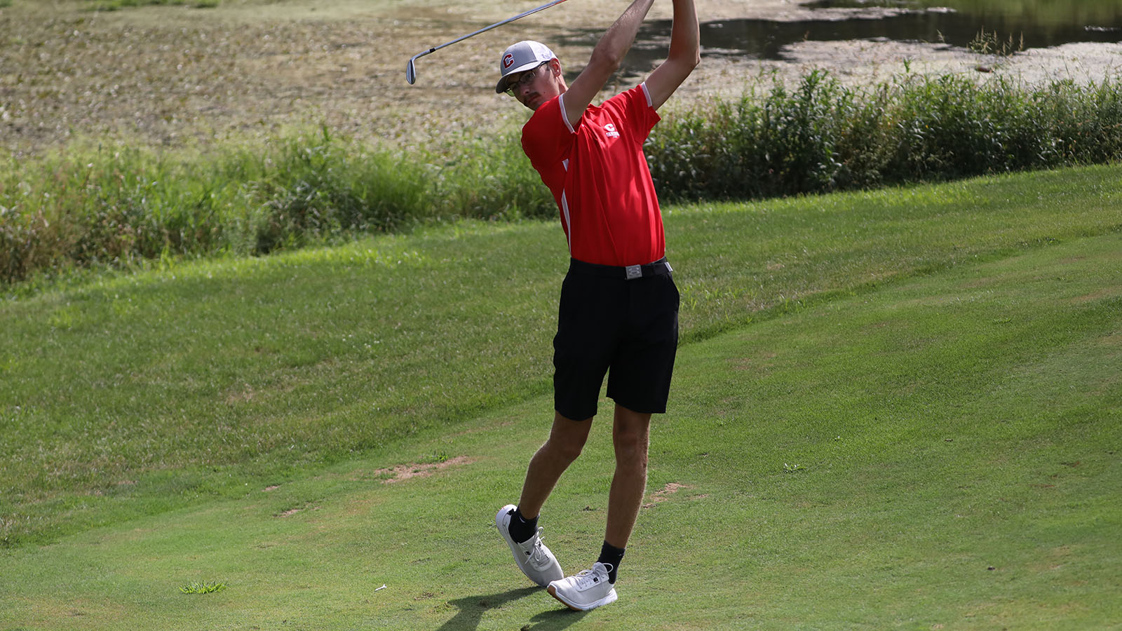Alex Gast watches his iron shot