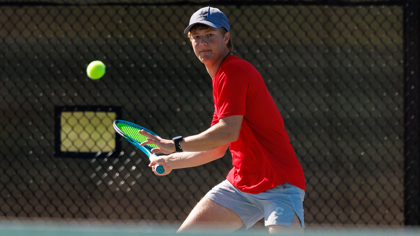 Alex Slaymaker follows ball to hit a forehand