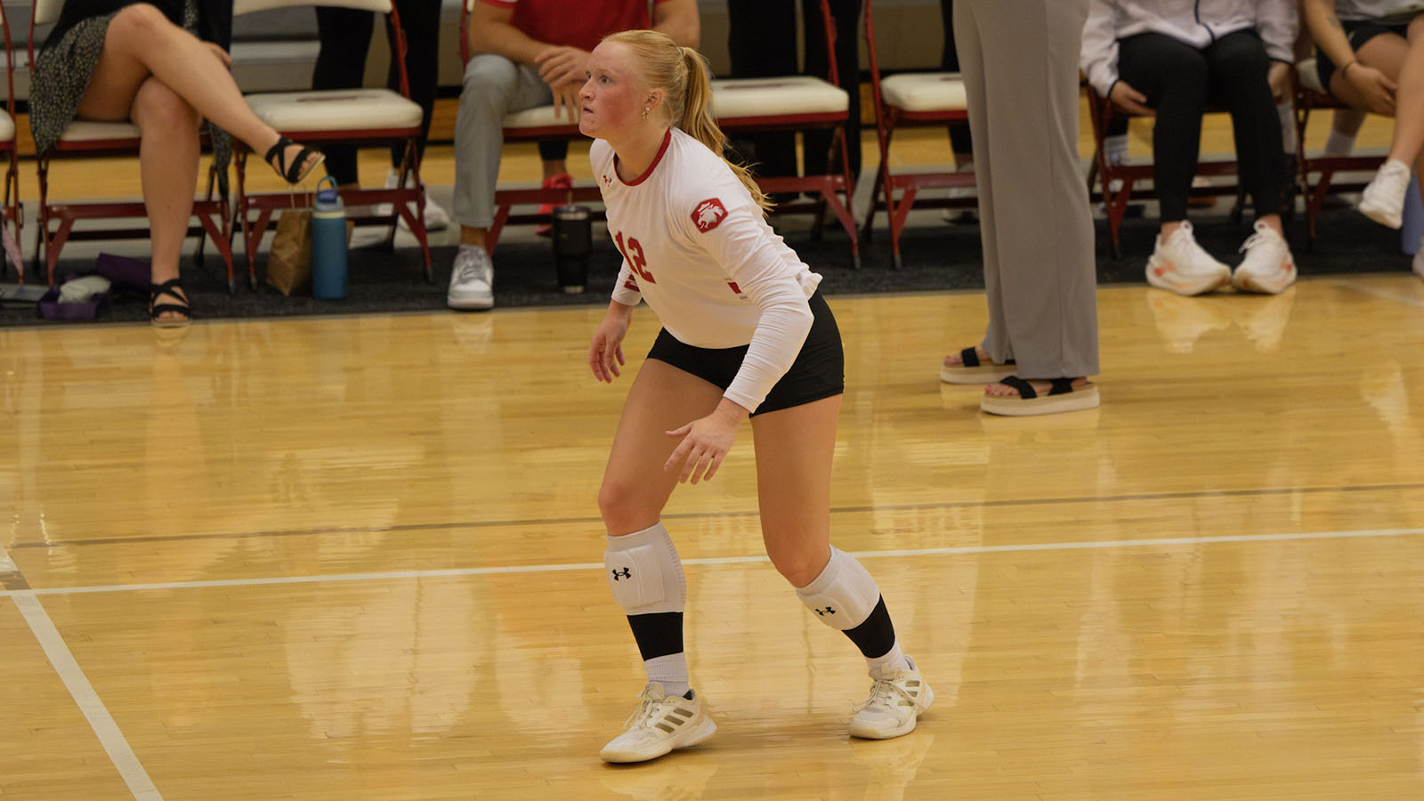 Landry Pacha playing volleyball against Monmouth College