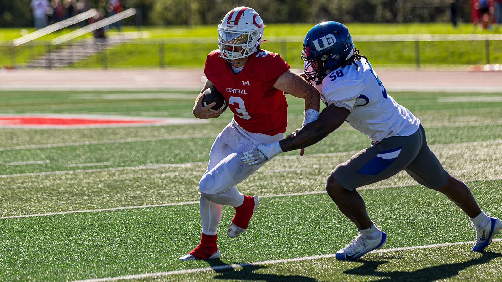 Quarterback Brett Connolly evades a Dubuque defender