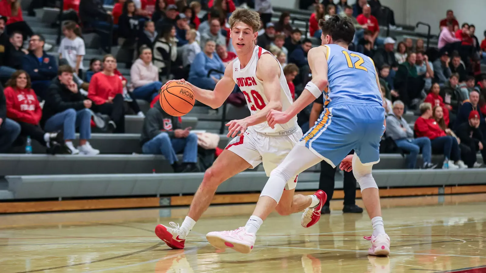 Alex Ruba dribbles past a defender