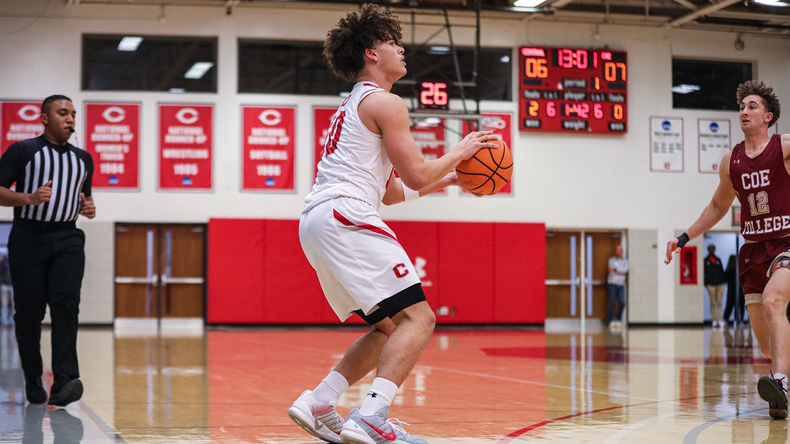 Braylon Thomsen shooting a three-pointer against Coe