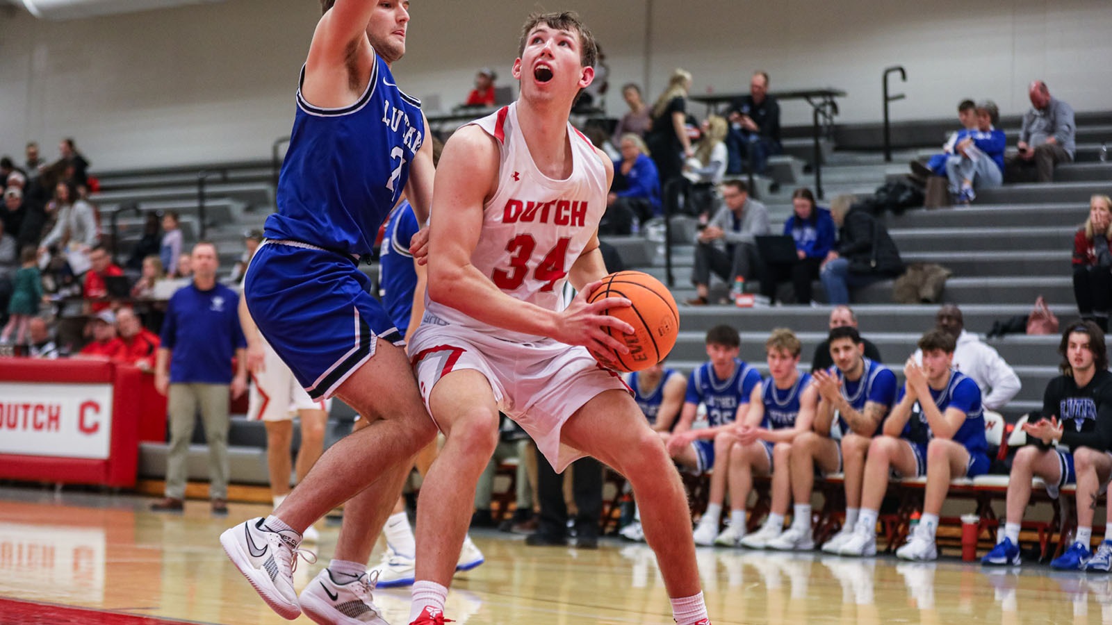 Owen Schipper battles Luther in the paint