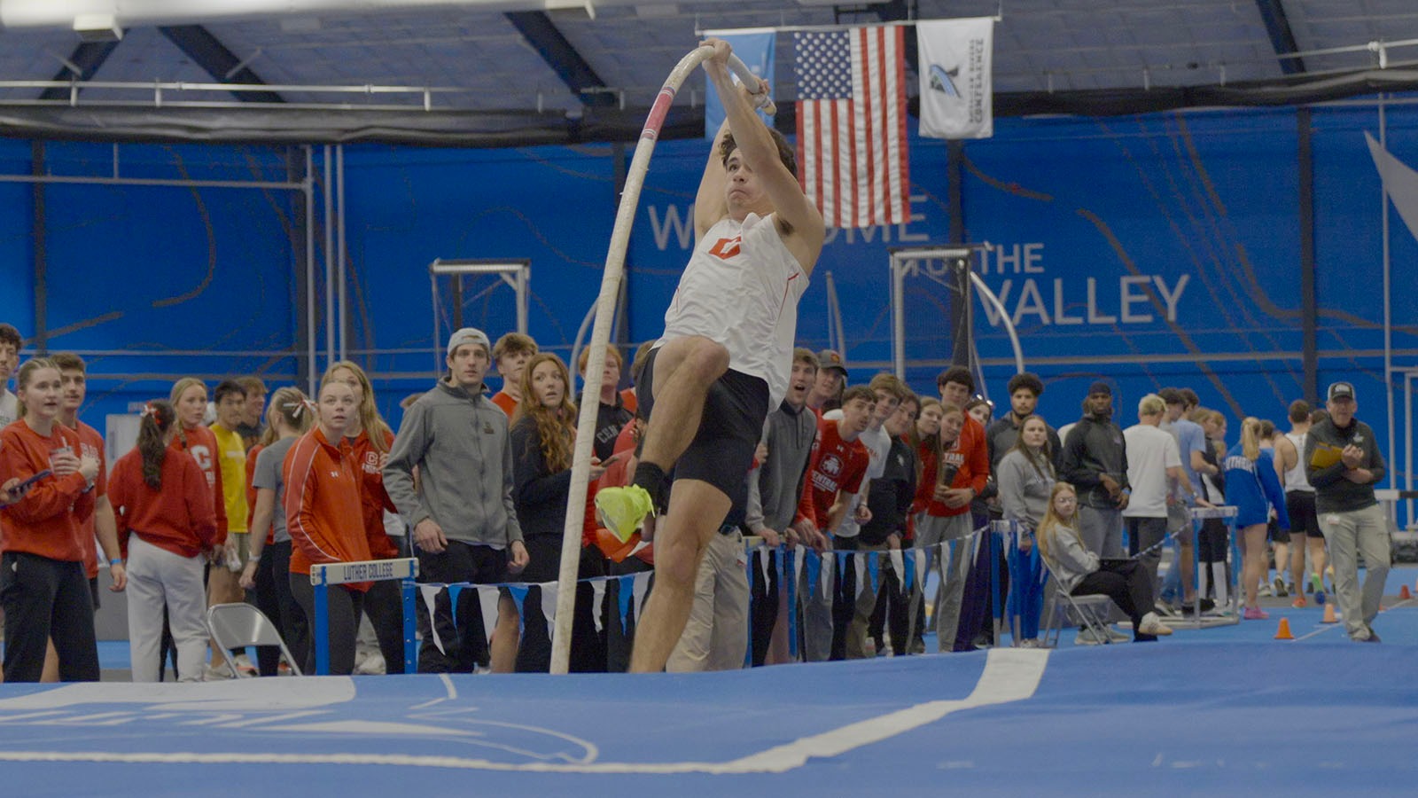 Kyle Rogers pole vaulting at indoor conference meet