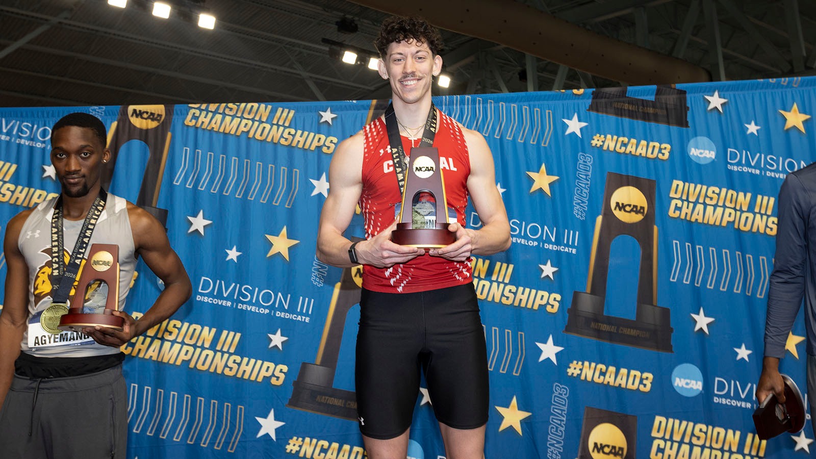 Gunner Meyer on 60-meter hurdles podium