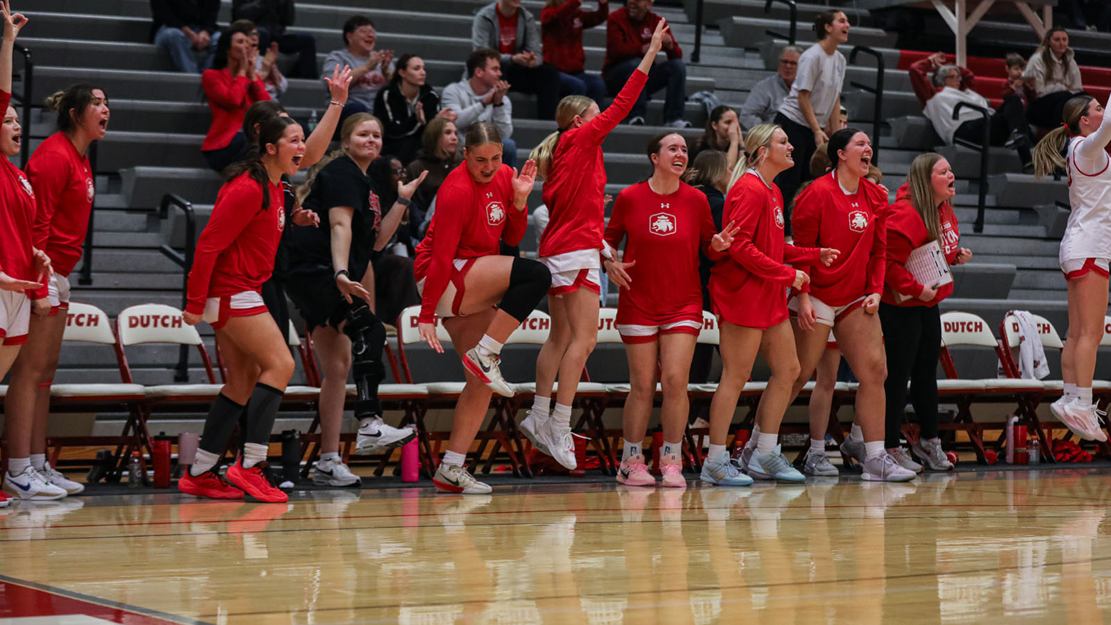 Central bench mob during Coe women's game