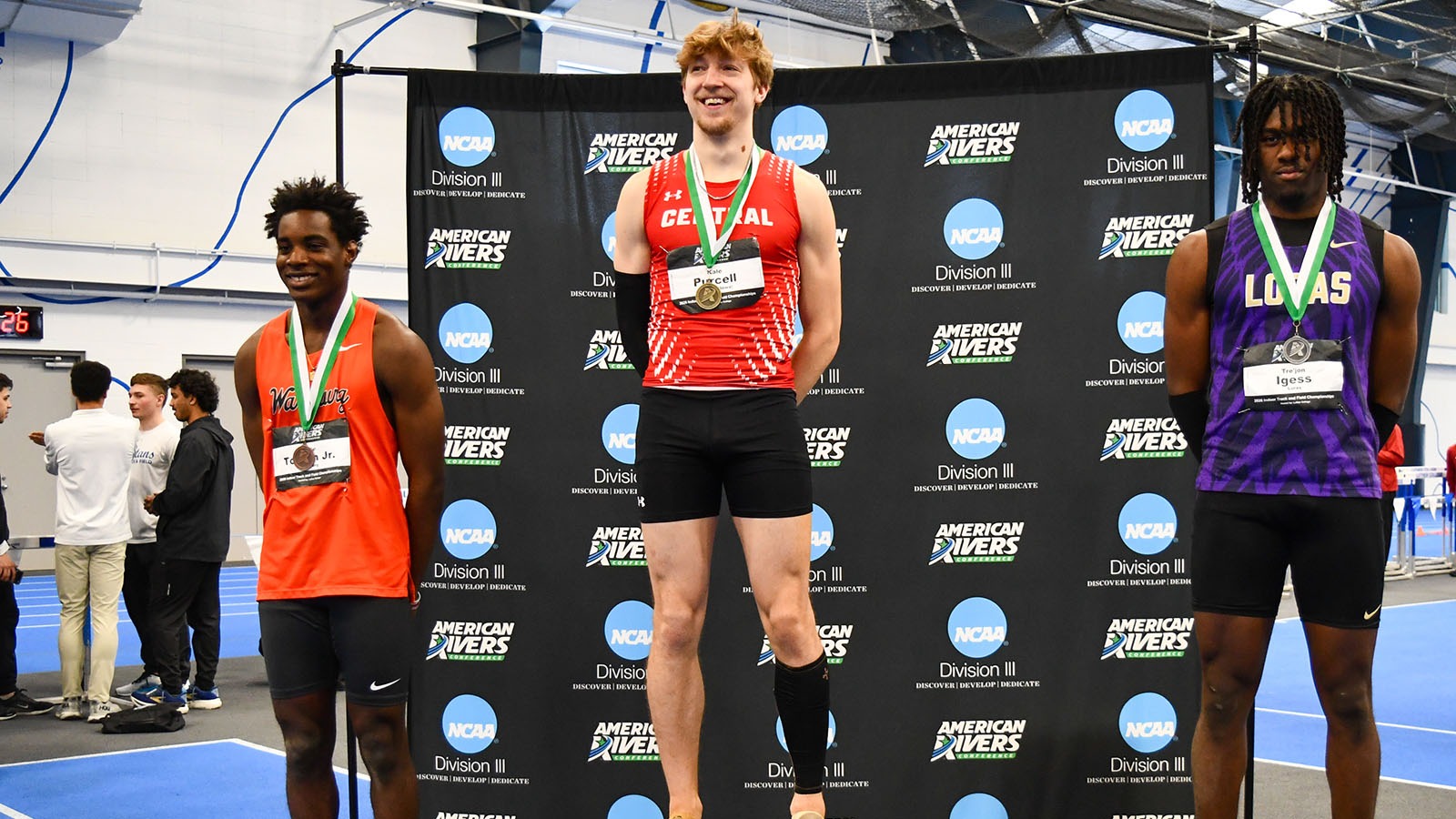 Kale Purcell on indoor triple jump podium